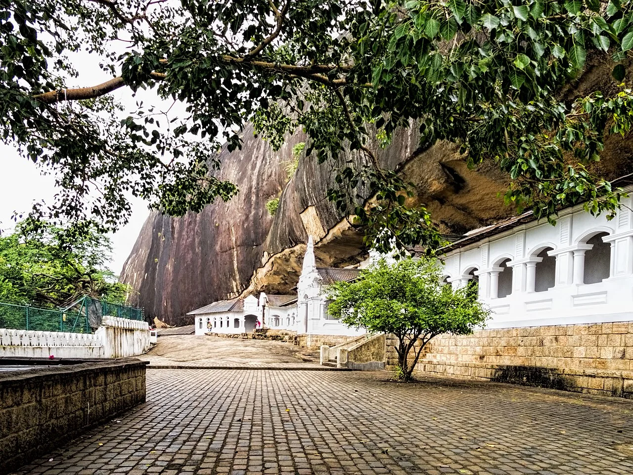 Dambulla - The Royal Rock Temple complex began in the 1st century BCE when King Valagamba was driven out of the capital of Anuradhapura and took refuge in the ca